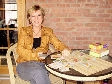Picture of Sandy at table with Tarot cards